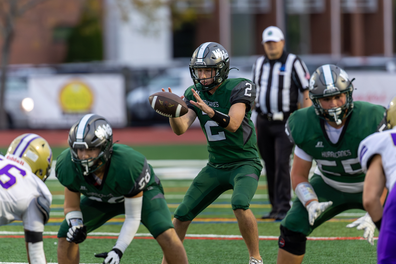 Senior quarterback Finn Drake grabs a snap. RON ESPOSITO