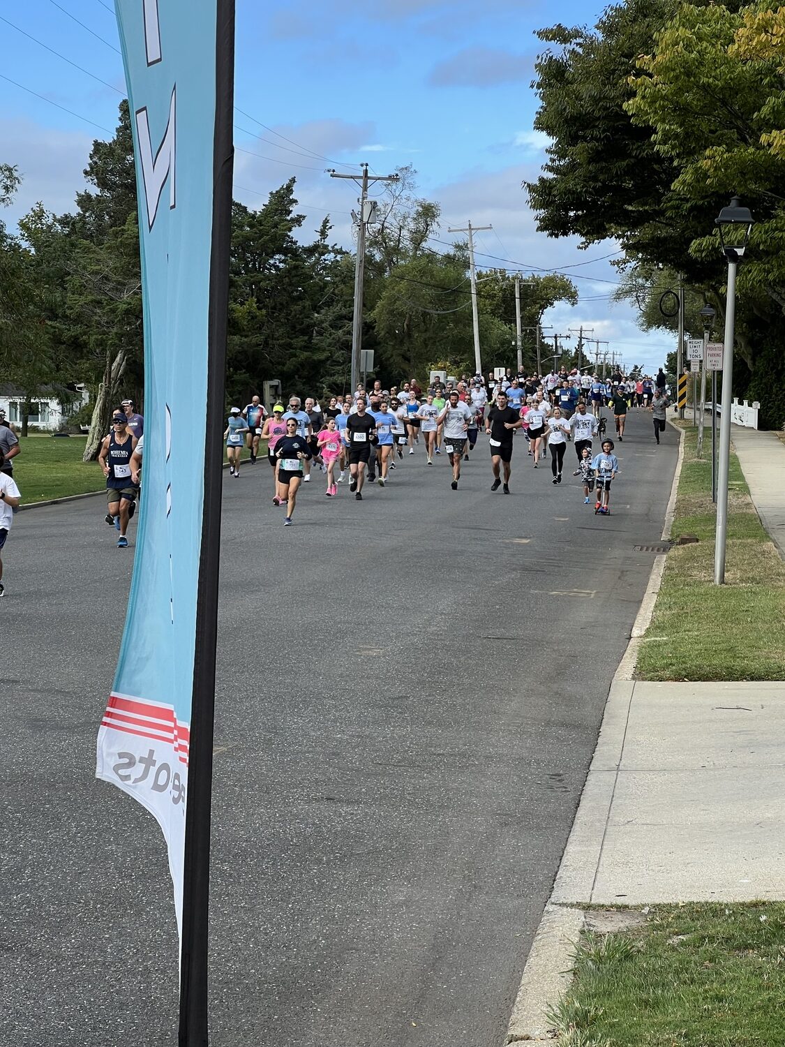 The Joseph Slomski Knights of Columbus Council 7423 recently held its fourth annual 5K race /walk starting at the Westhampton Marina, followed by a crossing of the Beach Lane Bridge, a trek down Dune Road, over the Swordfish Bridge, and ending at the finish line  back at the Marina. The event drew the largest number of participants to date – 225 plus – with the following top three finishers:
Sergey Avramenko (16:19 in first, Terence Nixdorf in second and Christopher Keogh, third, in the male category. Heather Wright took first (21:12),  Meaghan Serrarite, second; and Tracy Camarda, third. COURTESY JOSEPH SLOMSKI COUNCIL