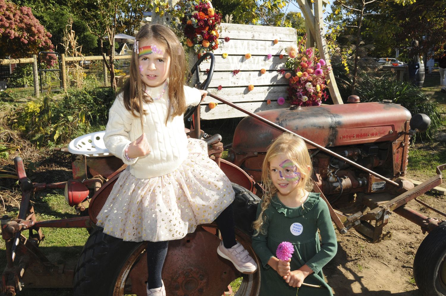 Mary DiGaetano and Ella Kittur at the Amber Waves Farm OKtoberfeast benefit on Saturday.  RICHARD LEWIN