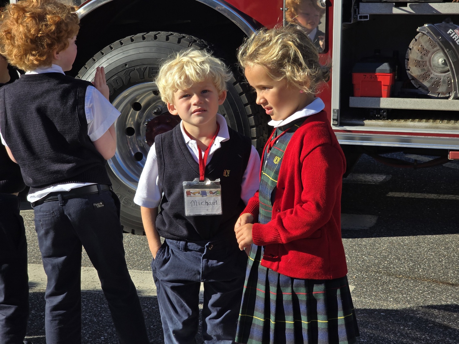 The Southampton Fire Department brought its red engines to Our Lady of the Hamptons School for a fire safety program. Students in kindergarten through third grade leaned 
strategies for safety, especially in the
home, as well as the work of firefighters. COURTESY OUR LADY OF THE HAMPTONS SCHOOL