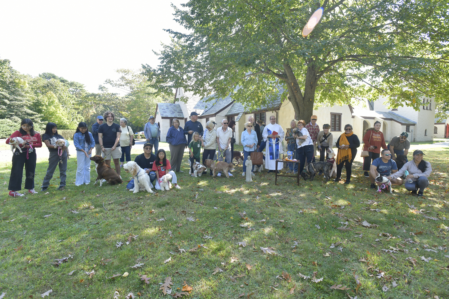 People gathered at St. Mary's Episcopal Church in Hampton Bays on Saturday to honor St. Francis with the Blessing of the Animals. The Rev. Justin A. Falciani, Rector, performed the blessings.  DANA SHAW