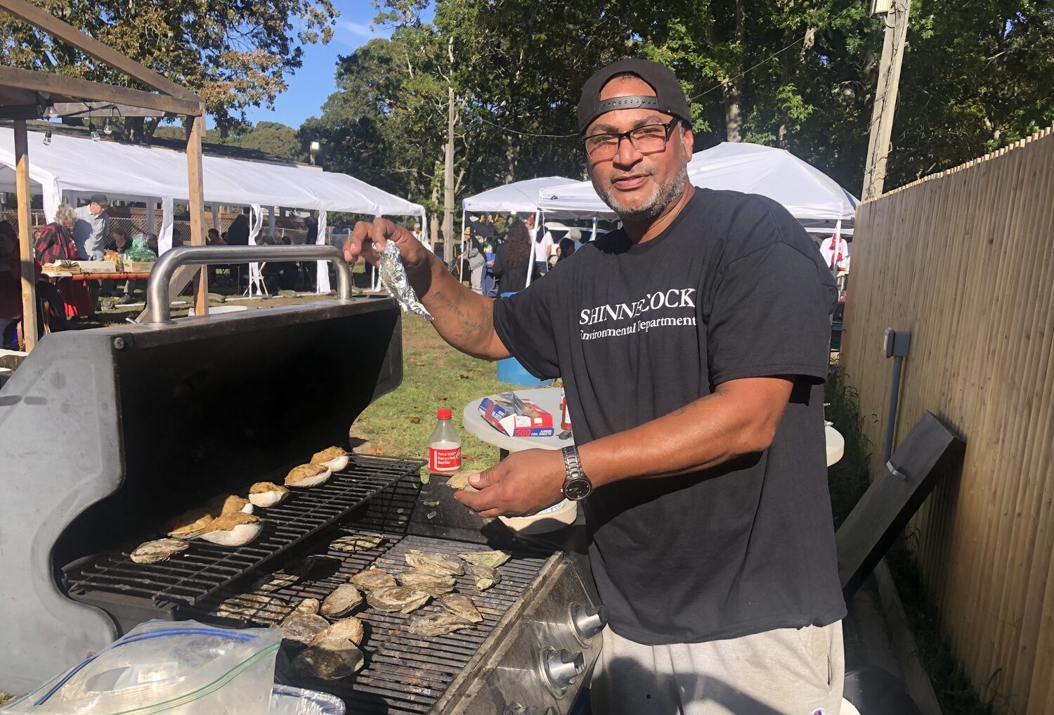 Baking oysters at the annual Oyster Festival on Indigenous Peoples Day, also known as Columbus Day. Considered a mini powwow of sorts, this is a day of live music, hand crafted products of local shells, seagrass, wood and leather, plus a variety of oyster dishes. Mark your 2025 calendar. JENNY NOBLE