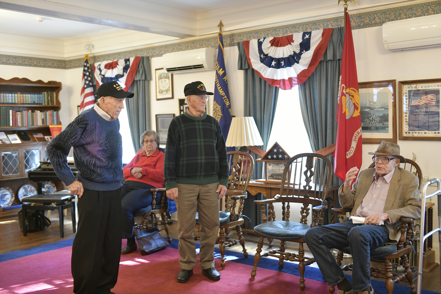 Donald Schreiber, Stanley Penske and James Witker, the three surviving members of the Eastern Long Island Chapter of the Korean War Veterans vote to disband the chapter at the final meeting on Saturday at Veterans Hall in Southampton Village.    DANA SHAW