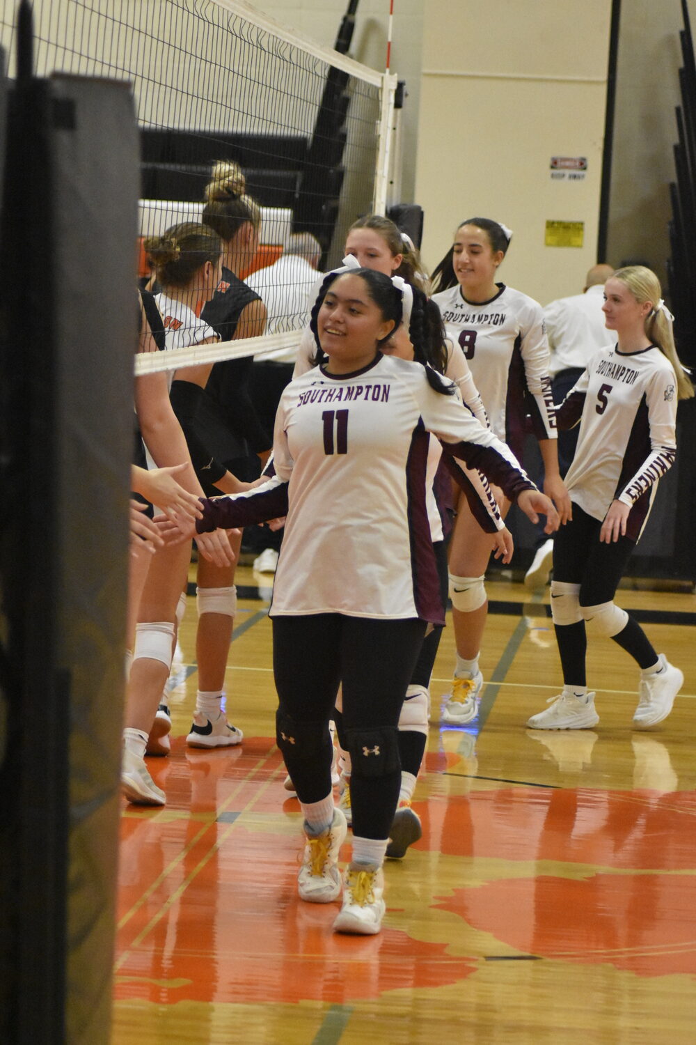 Sophomore Lucia Obregon leads the Mariners onto the court.   DREW BUDD