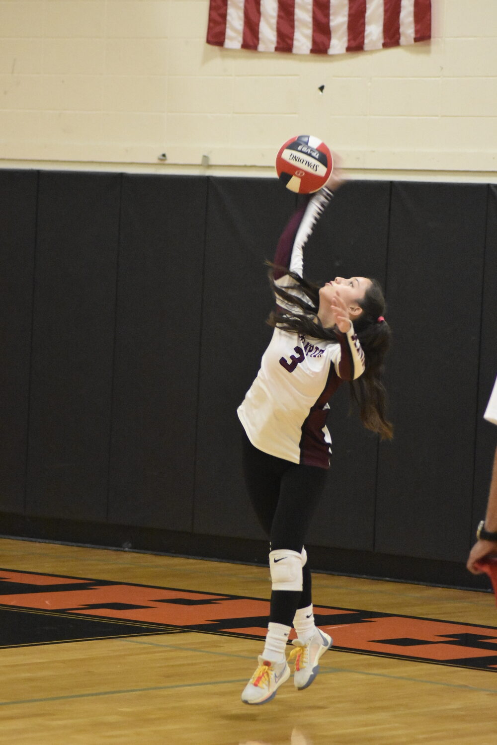 Southampton junior Danna Nieto serves.   DREW BUDD