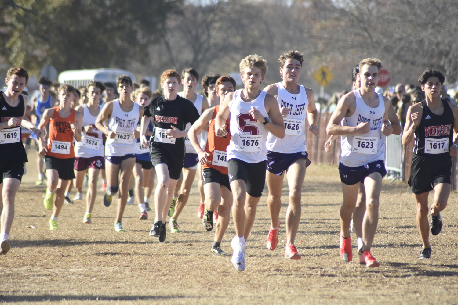 Southampton senior Christian Duggal starts the race at the head of the pack.   DREW BUDD