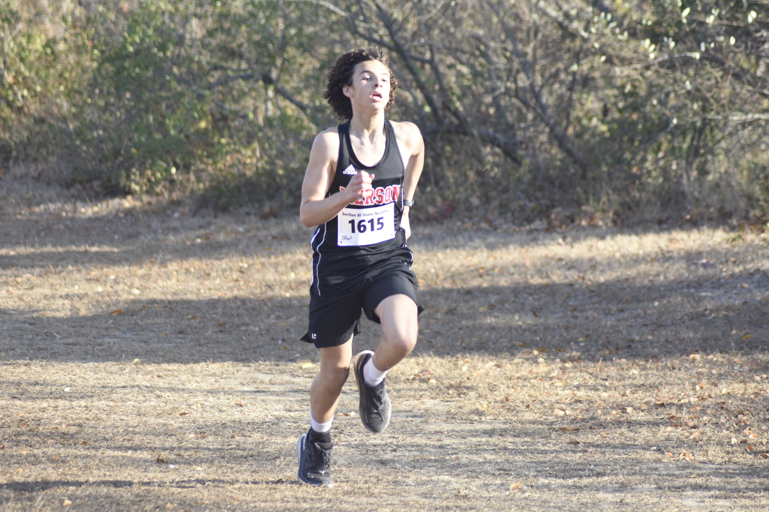 Pierson's Ben Ezeir heads toward the finish line.  DREW BUDD