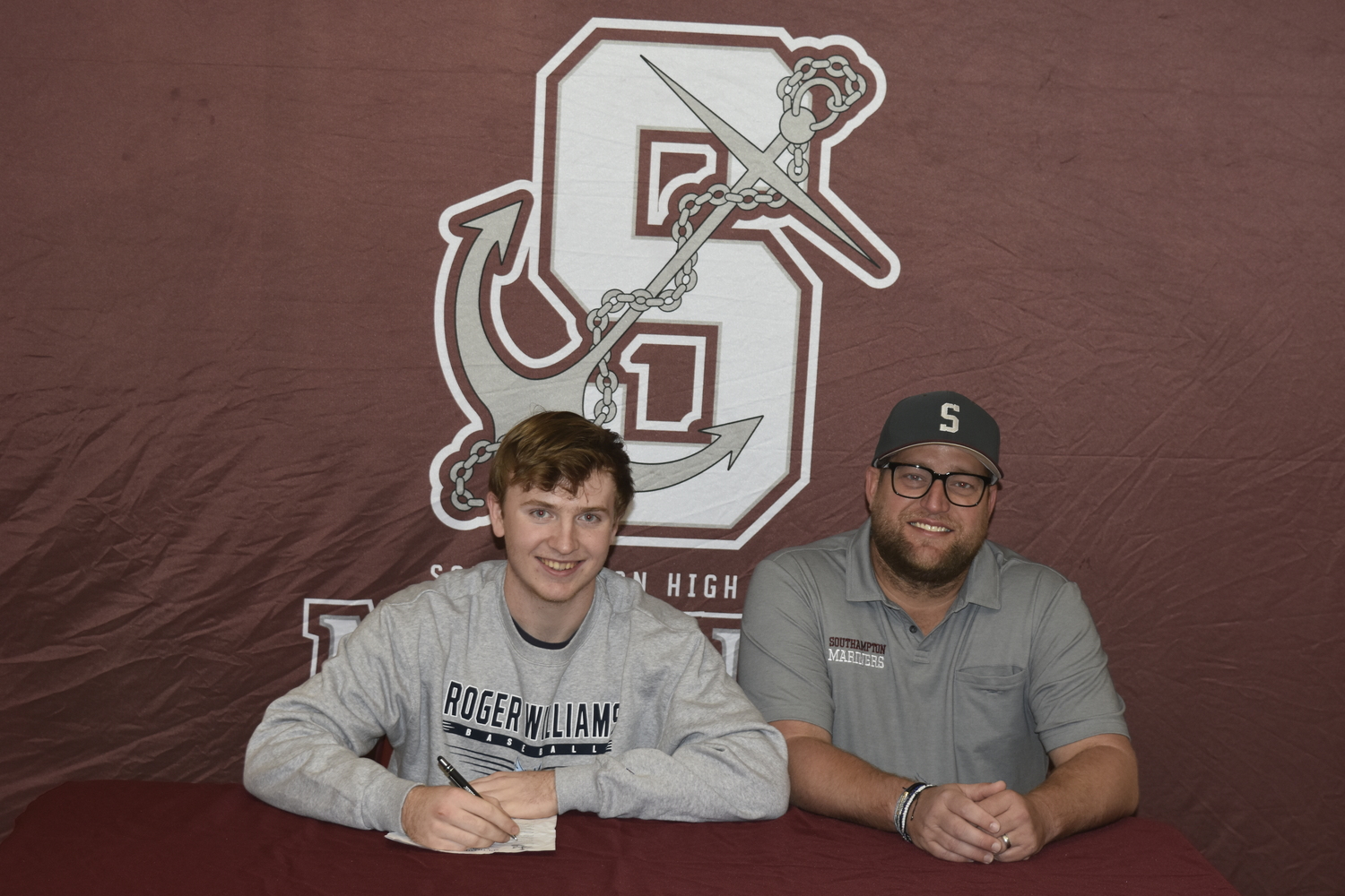 Southampton senior Daniel McDonnell, with his head coach Zach Epley, signs his letter of intent to play baseball at Roger Williams University.    DREW BUDD