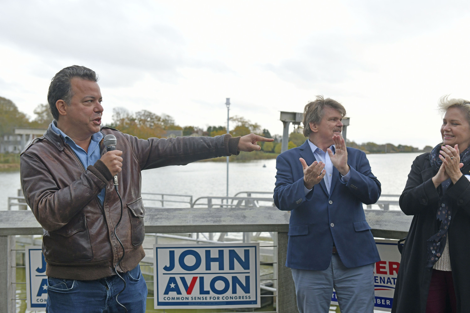 Democratic candidates John Avlon, Tommy John Schiavoni and Sarah Anker at a rally in Agawam Park in Southampton on November 4.  DANA SHAW