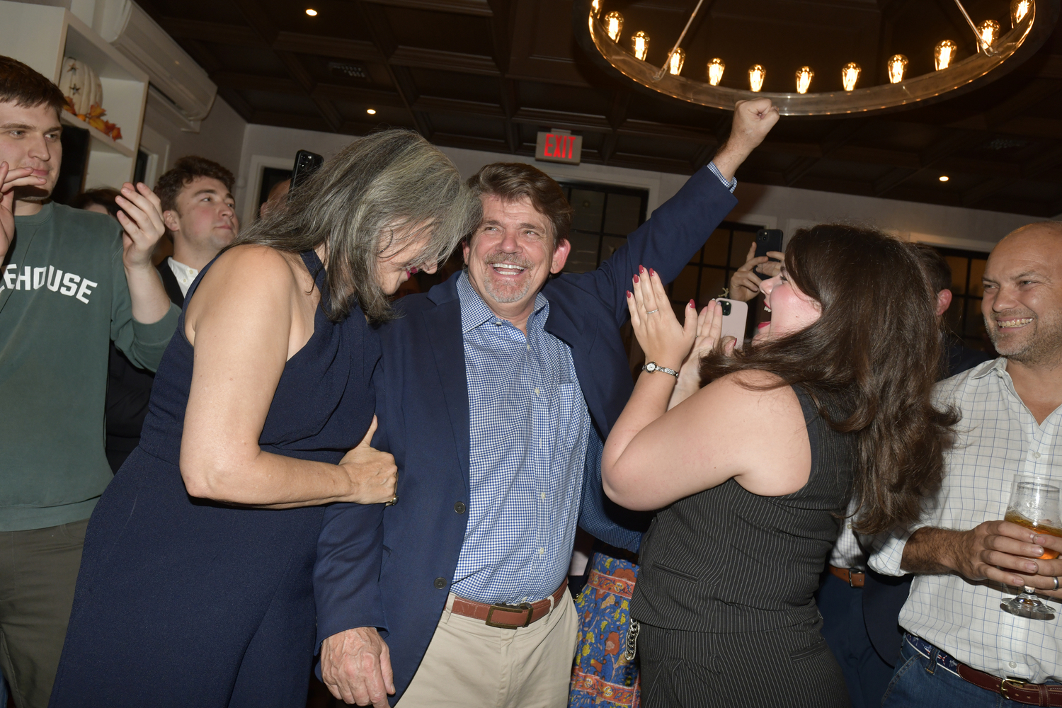 Tommy John Schiavoni, celebrates with his wife Andrea and daughter Anna Francesca, after winning the 1st District Assembly race against Republican Stephen Kiely. DANA SHAW