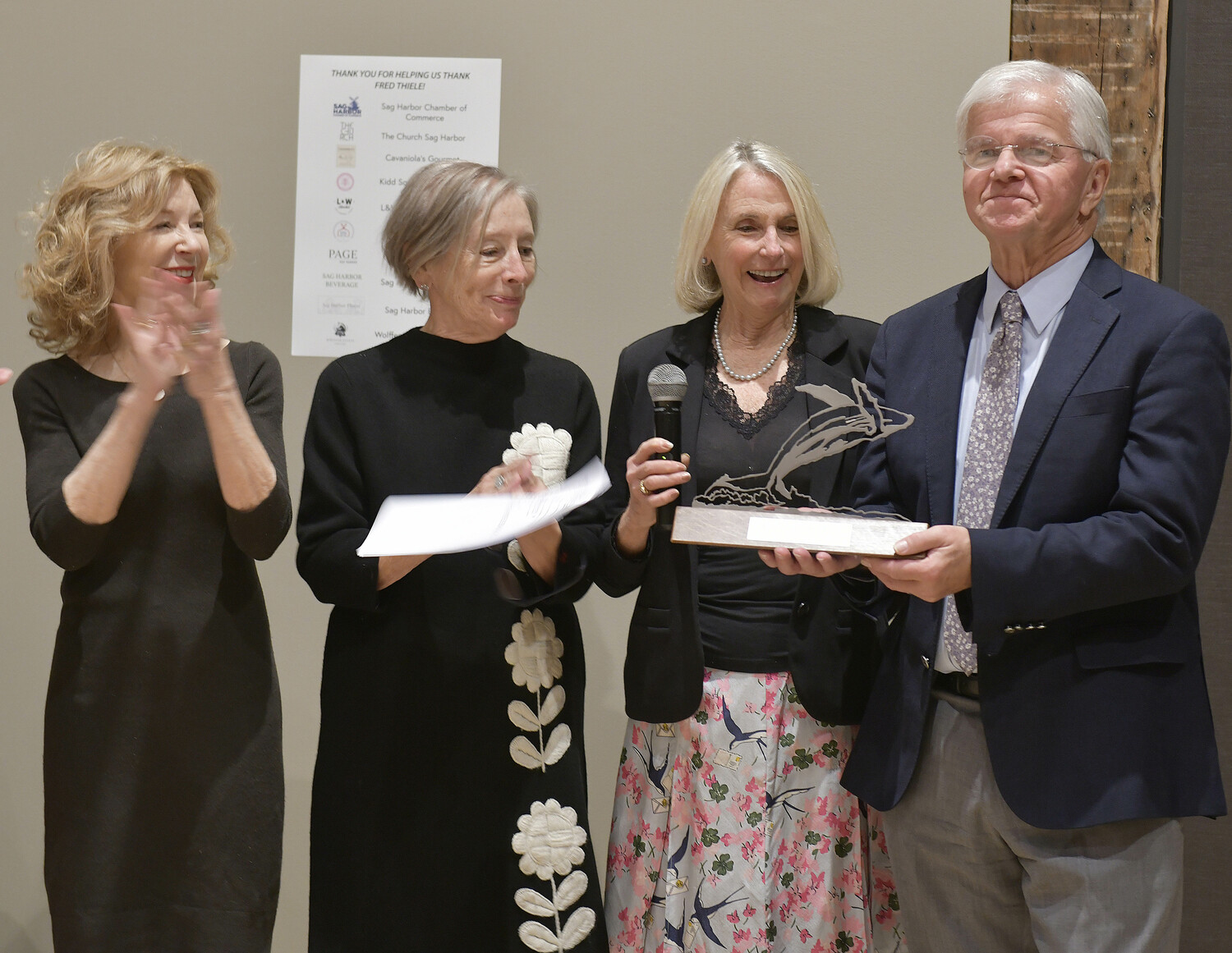 Members of Sag Harbor Partnership, April Gornik, Susan Mead and Jayne Young present Assemblyman Fred W. Thiele Jr. with their Community Service award on November 22 at The Church.  DANA SHAW