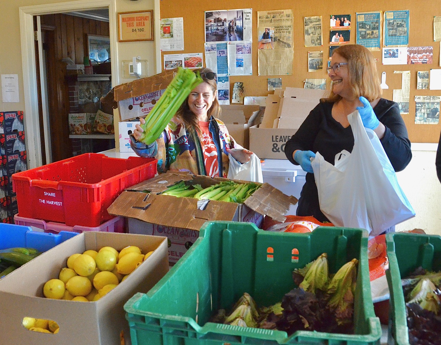 Volunteers sort produce for grocery pickup at the Springs Food Pantry. KYRIL BROMLEY