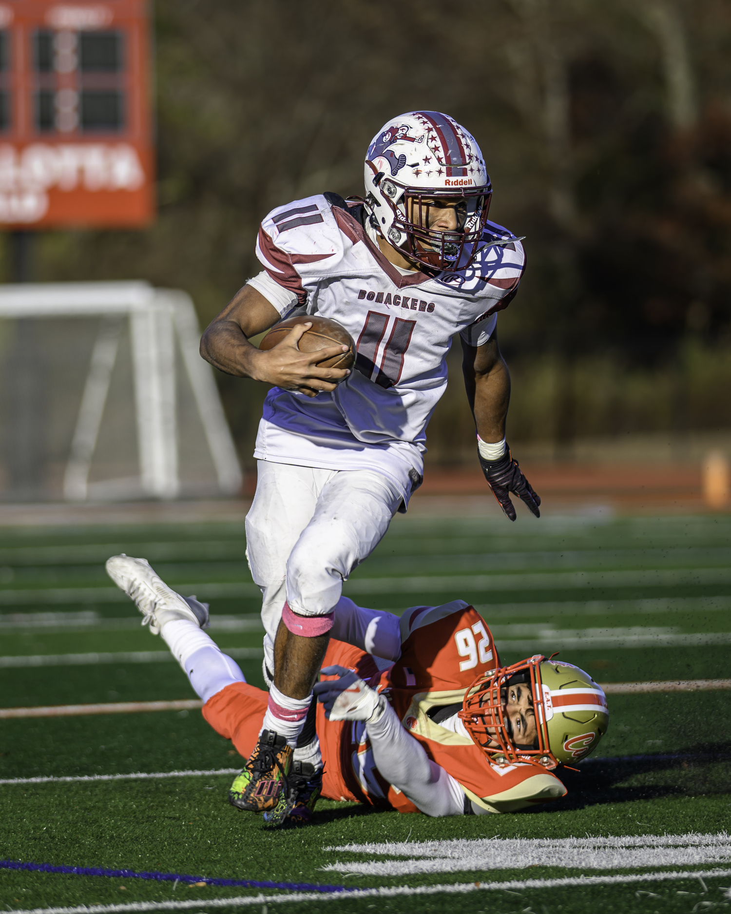 Bridgehampton junior Jai Feaster gets out of the grasp of a Hills West defender.   MARIANNE BARNETT