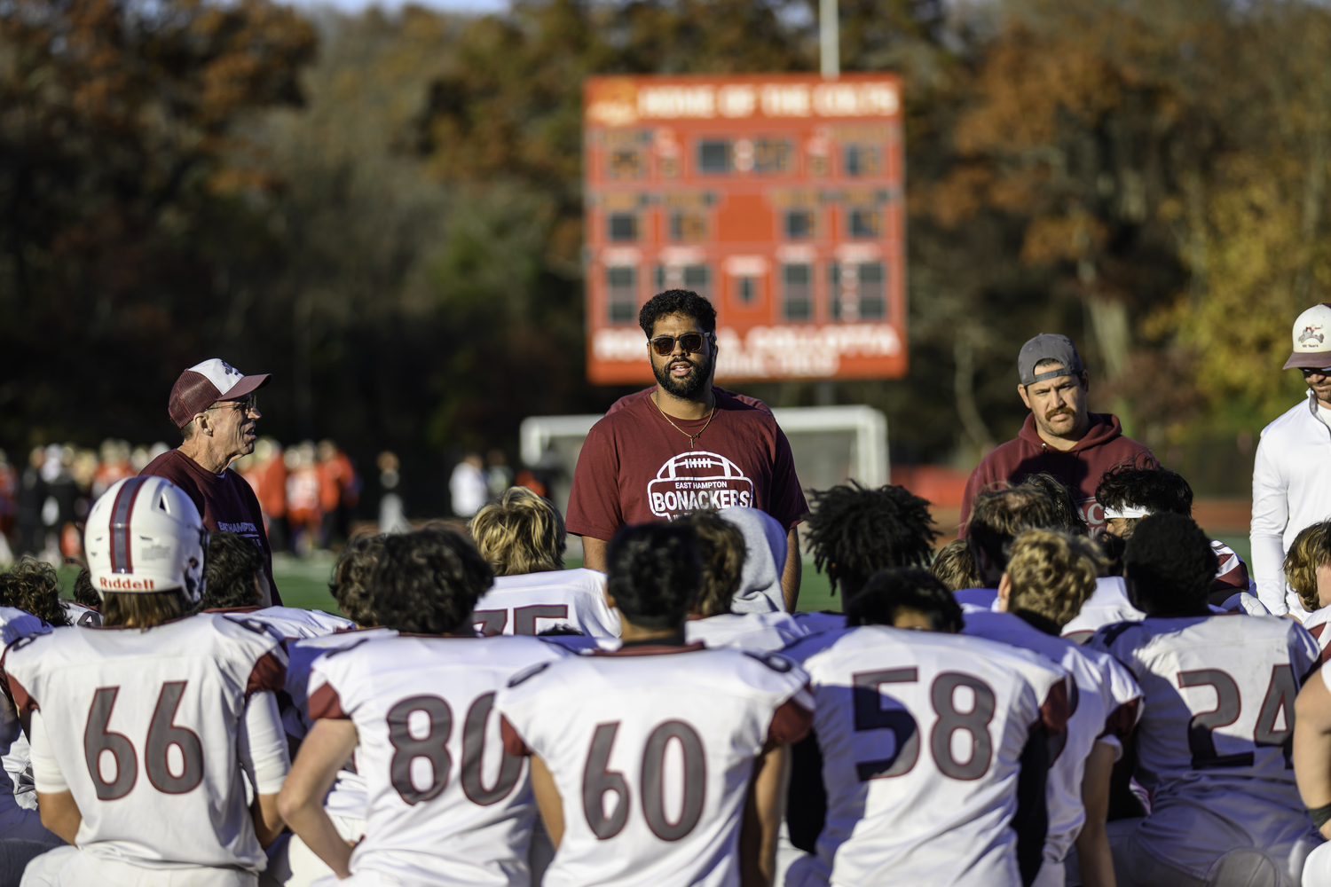 East Hampton assistant coach Jaron Greenidge talks to the players after Saturday's loss at Hills West.   MARIANNE BARNETT