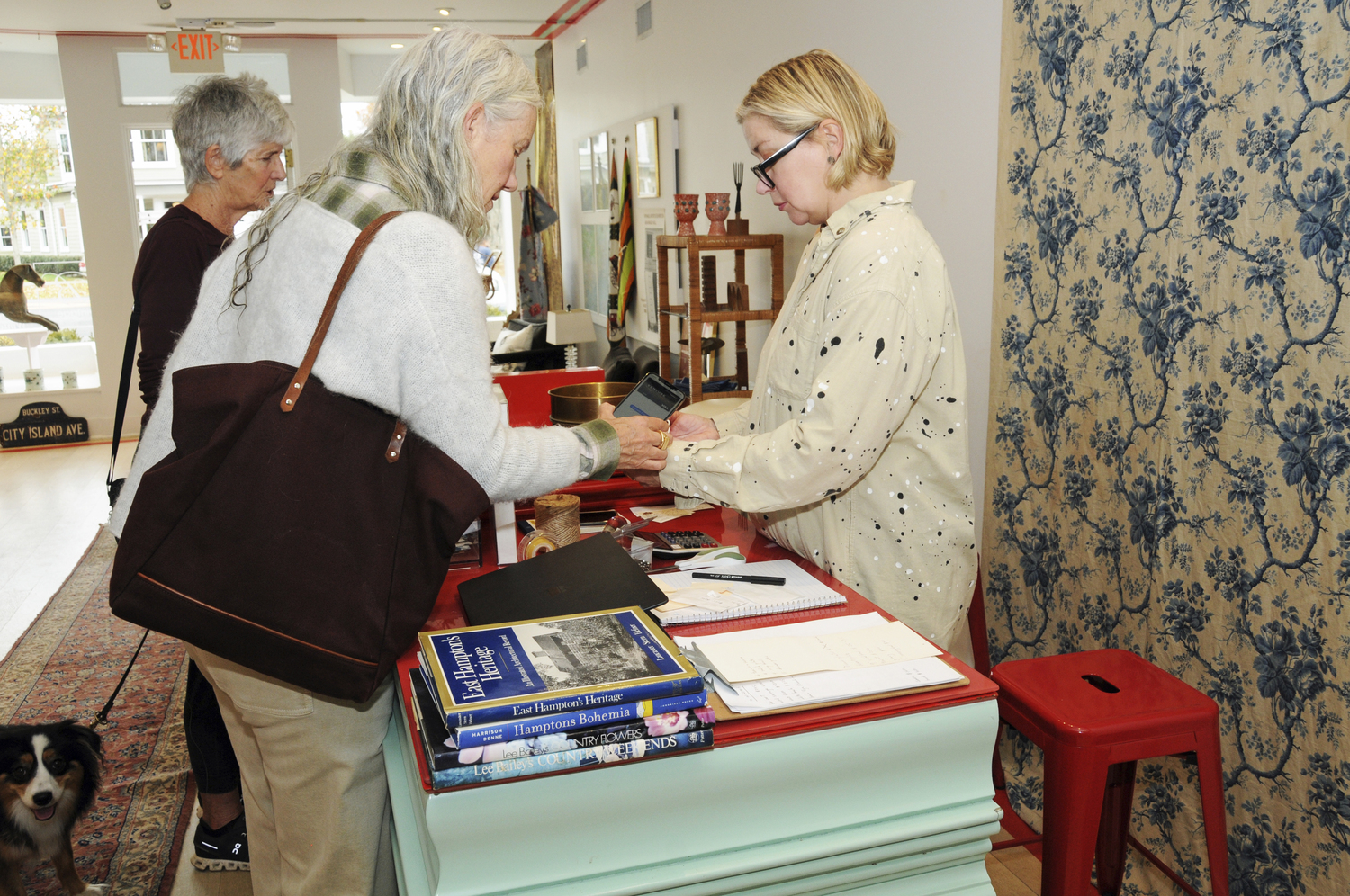 Susan Nieland is the store's first paying customer at  the opening of  pop-up store B Vintage on Friday at at 79 Main Street in East Hampton the shop run by mother and daughter Cristina and Linda Buckley is part of the The Anchor Society's plan to fill store fronts in the off season.  RICHARD LEWIN