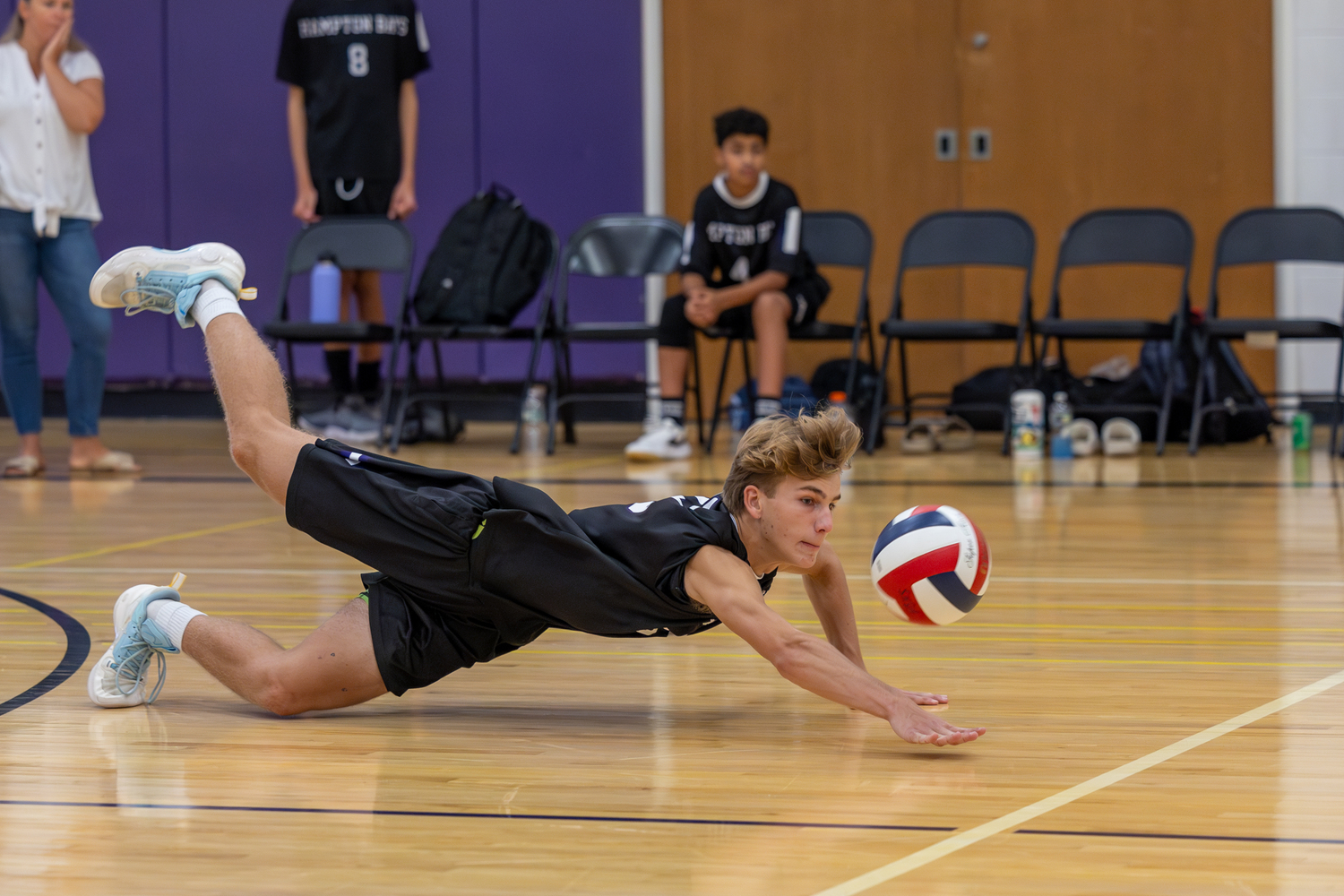 Junior Charlie Patek dives to make a save. RON ESPOSITO