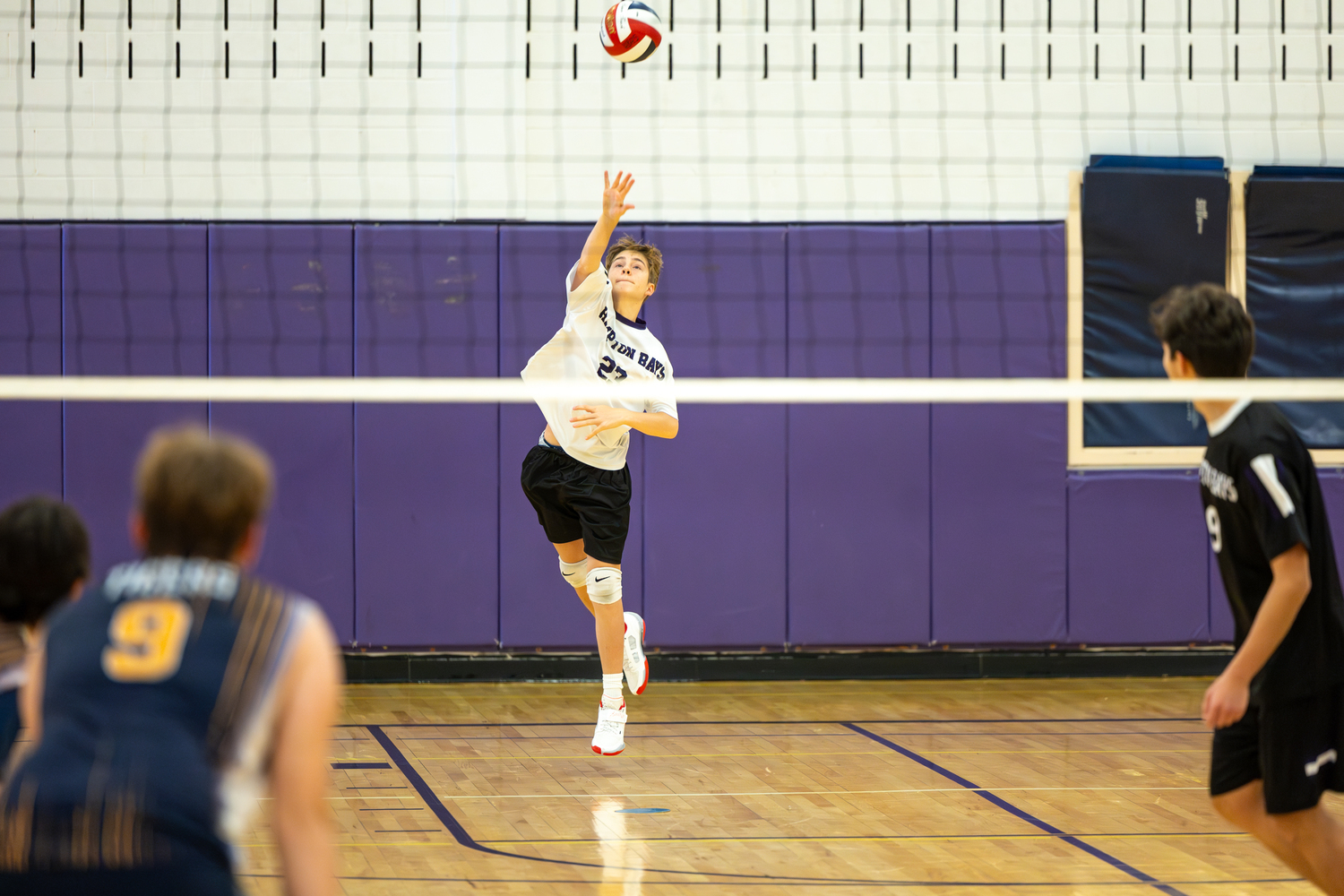 Eighth-grader Peyton Single serves. RON ESPOSITO