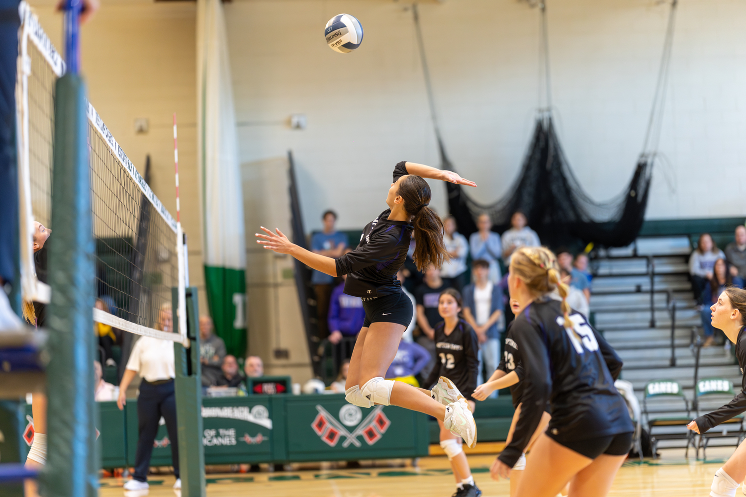 Hampton Bays sophomore middle blocker Kirra Schoerlin leaps up to spike the ball. RON ESPOSITO