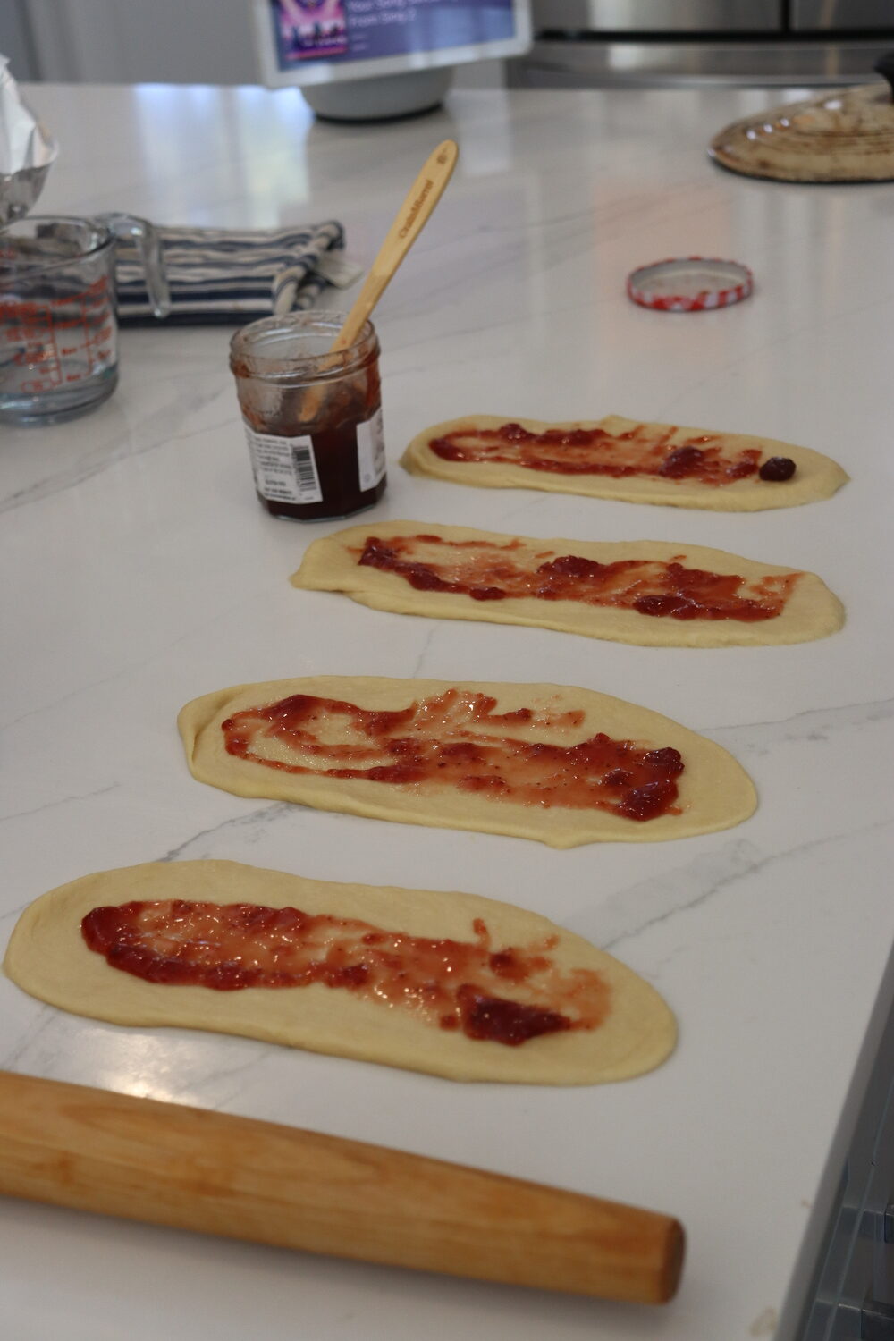 Preparing jelly-filled challah. CAILIN RILEY