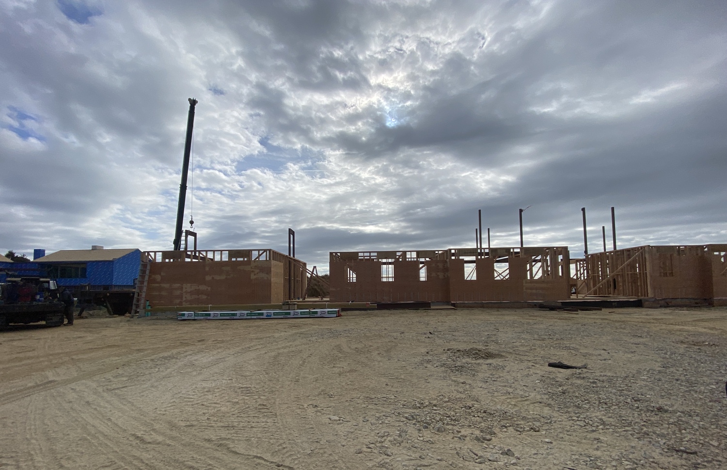 This house under construction is one of a cluster of large houses going up around the farm fields on Wainscott Hollow Road in Wainscott. CHRISTOPHER WALSH