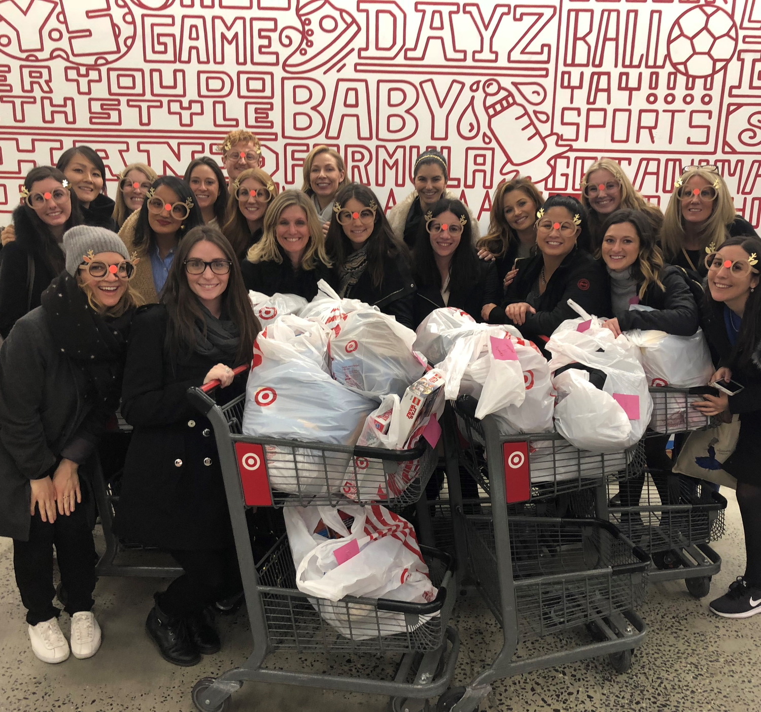 L'Oreal employees shop for the Adopt-a-Family program. COURTESY THE RETREAT