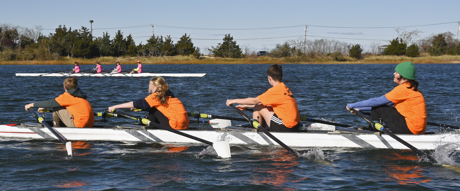 First place Team Orange, once again edging out second place Team Pink, in this quad-scull duel to the finish line. MICHAEL MELLA