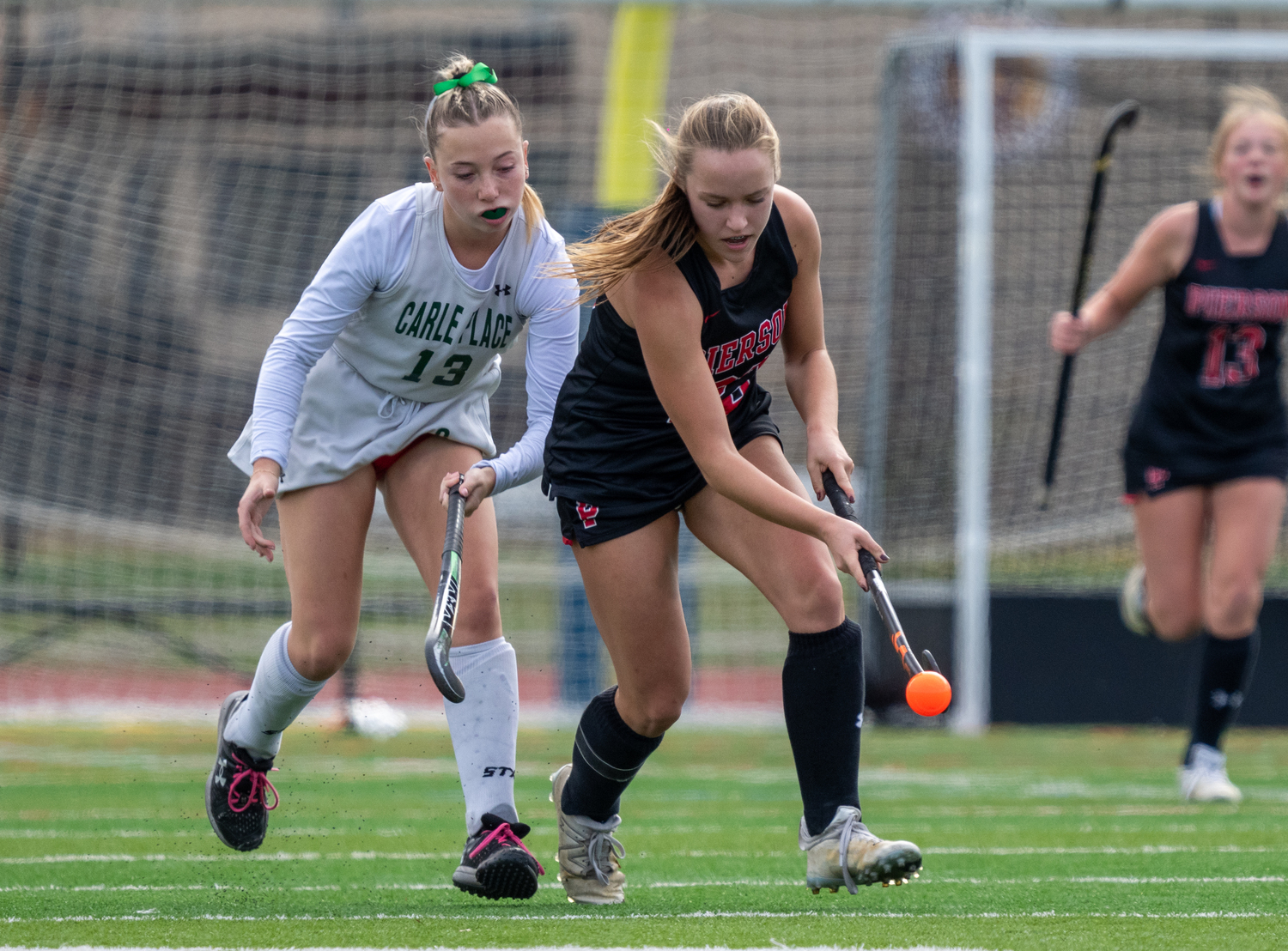 Pierson senior Bella Eldridge pats the ball down to the turf with her stick.  RON ESPOSITO