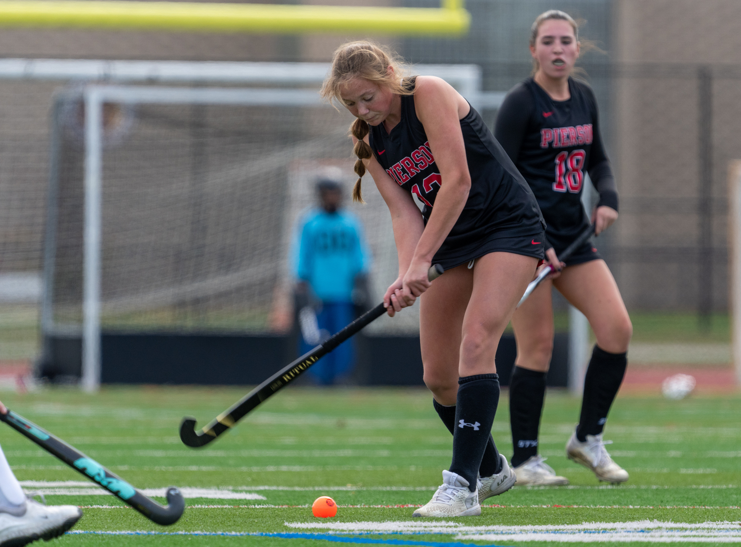 Pierson senior Cali Wilson hits the ball upfield.  RON ESPOSITO