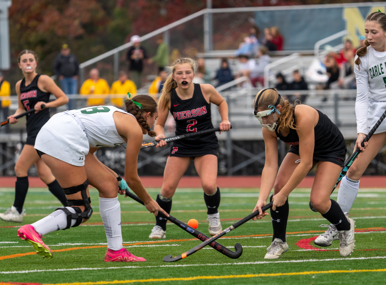 Pierson sophomore Lola Eldridge and Carle Place sophomore Ava Gomes go after the ball.   RON ESPOSITO