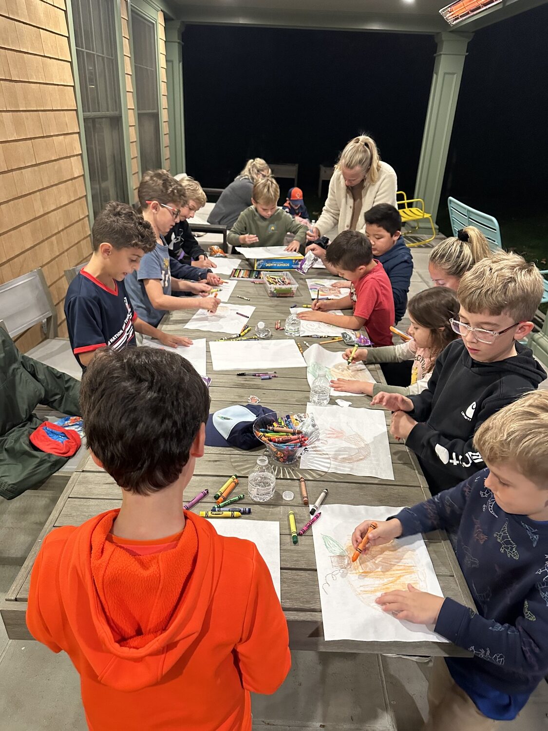 Cub Scout Pack 483 has a busy week last week. At one meeting they colored Thanksgiving placemats to be distributed at the town's senior centers and, on another day, toured Southampton Town Police Department. COURTESY PACK 483