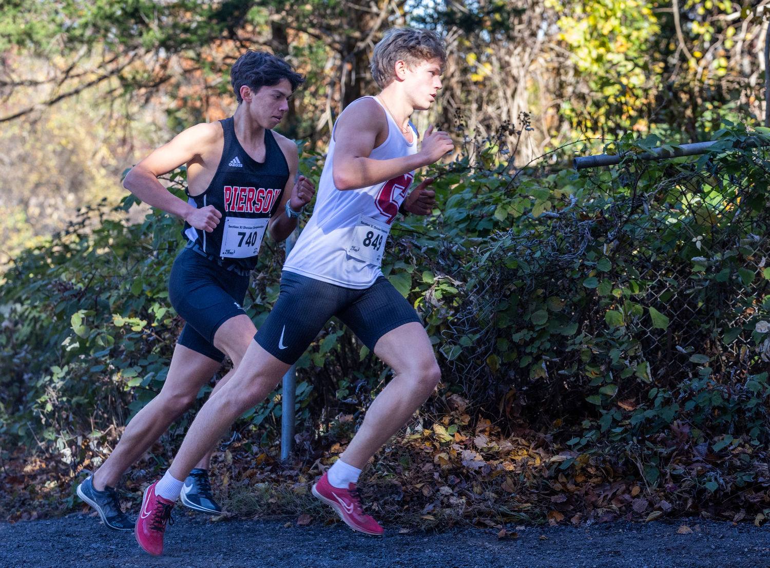 Southampton senior Christian Duggal turning a corner at the Division IV Championships with Pierson senior Edmar Gonzalez-Nateras. RON ESPOSITO