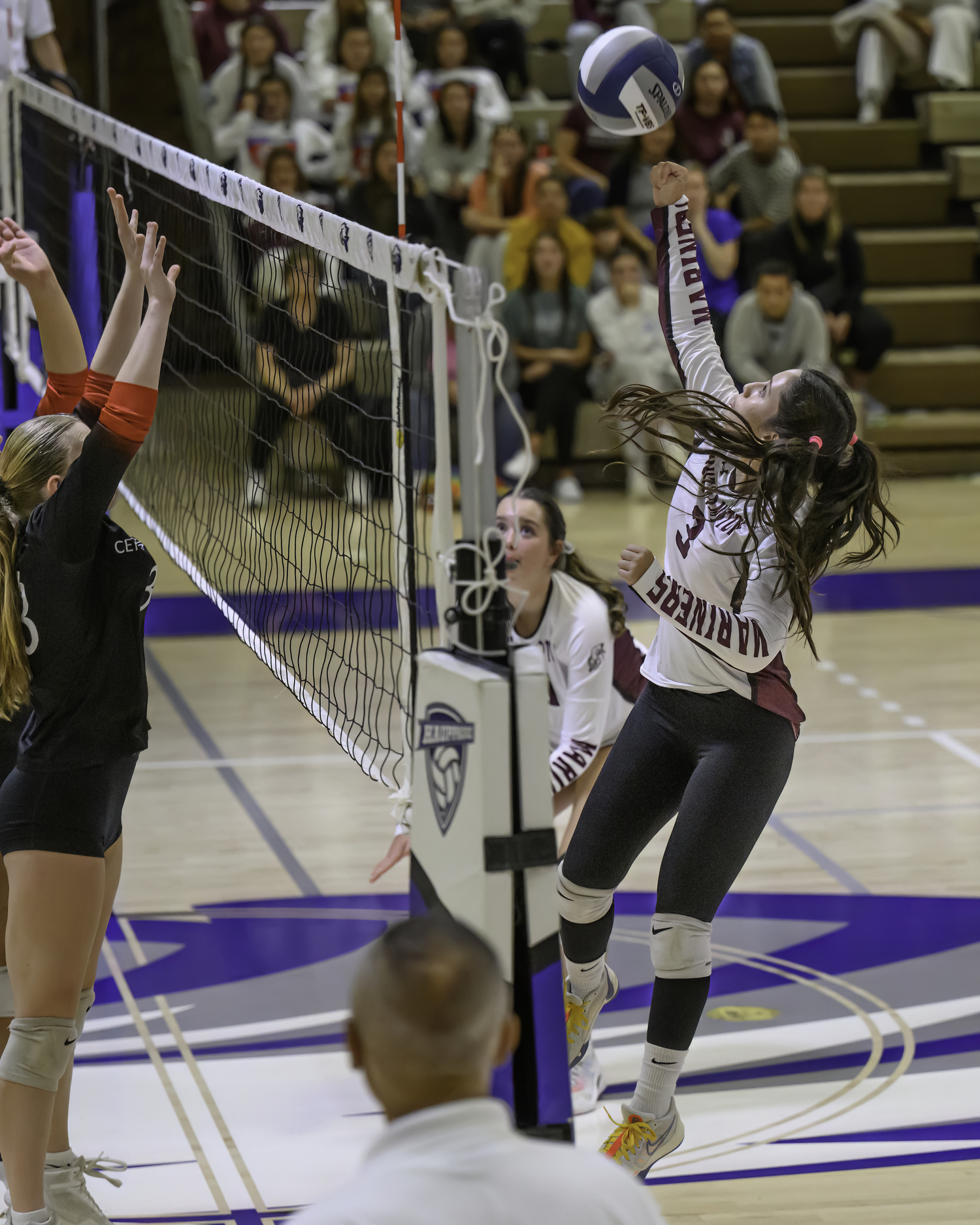 Danna Nieto punches the ball over the net.   MARIANNE BARNETT