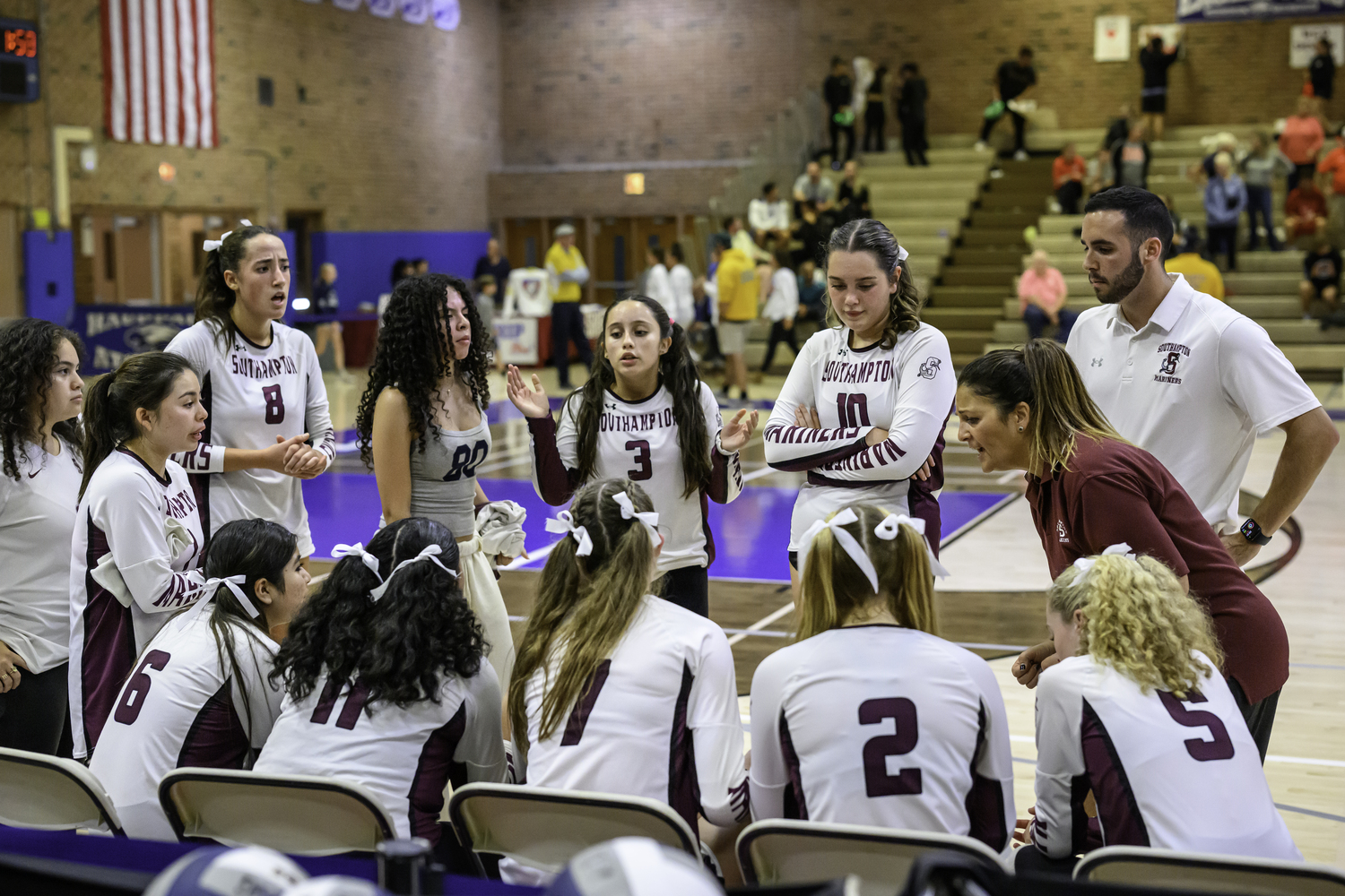 Southampton head coach Jorgine Buccio gives her team a pep talk during a timeout.   MARIANNE BARNETT