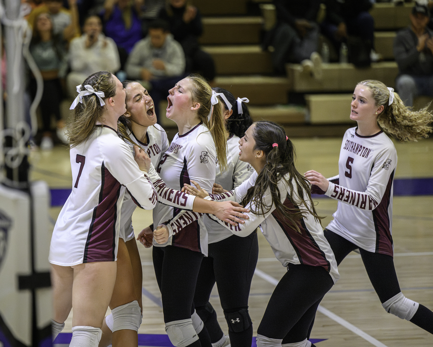 The Mariners celebrate a point.   MARIANNE BARNETT