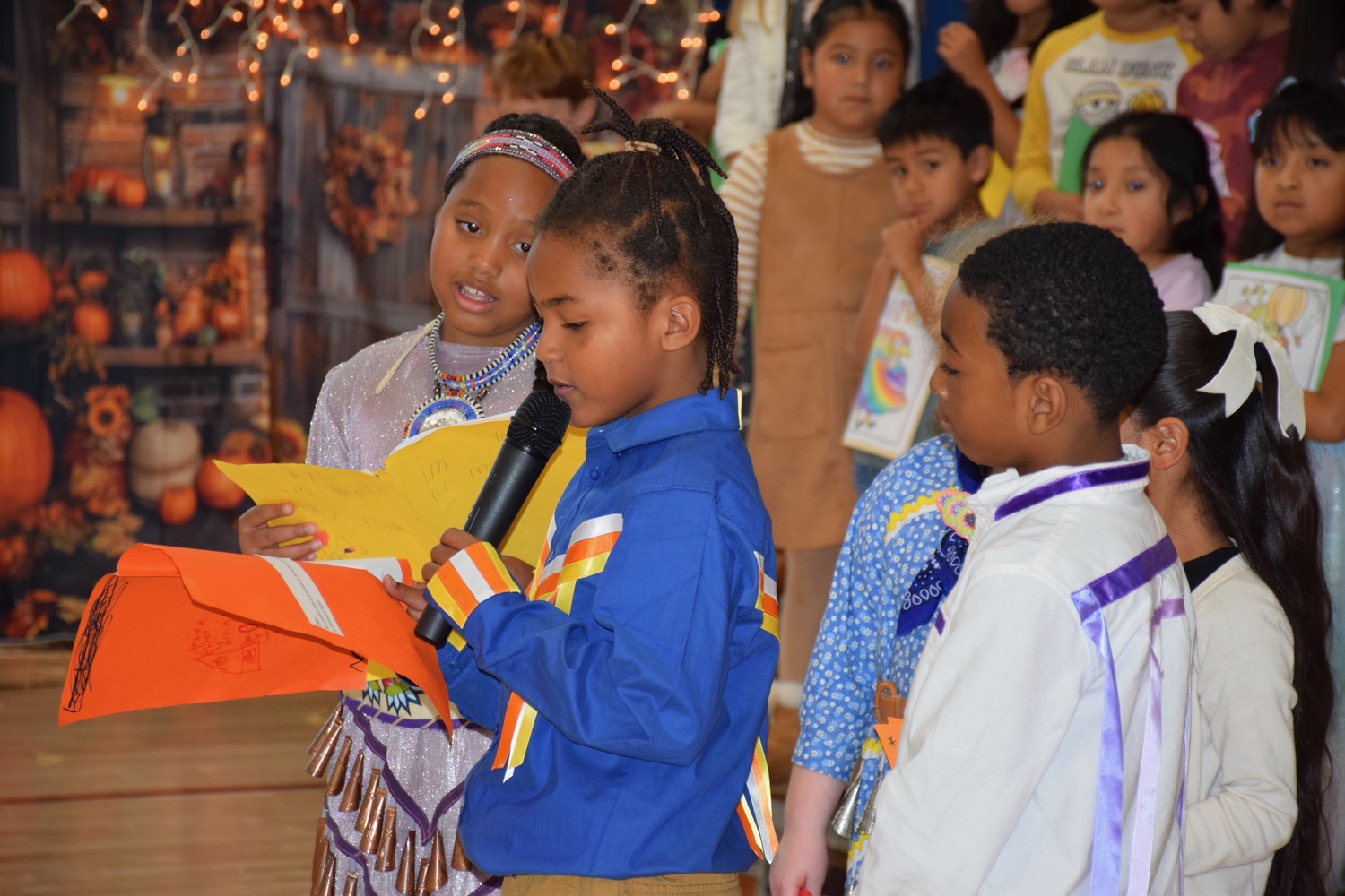 Southampton Elementary School hosted its annual second grade Thanksgiving gathering on November 21. The event focused on family and community, with students performing songs, sharing a Thanksgiving poem and enjoying food with their families. Also, during the event, representatives from the Shinnecock Indian Nation spoke about their traditions related to giving thanks, performed a traditional dance and song with students and gave a blessing. COURTESY SOUTHAMPTON SCHOOL DISTRICT