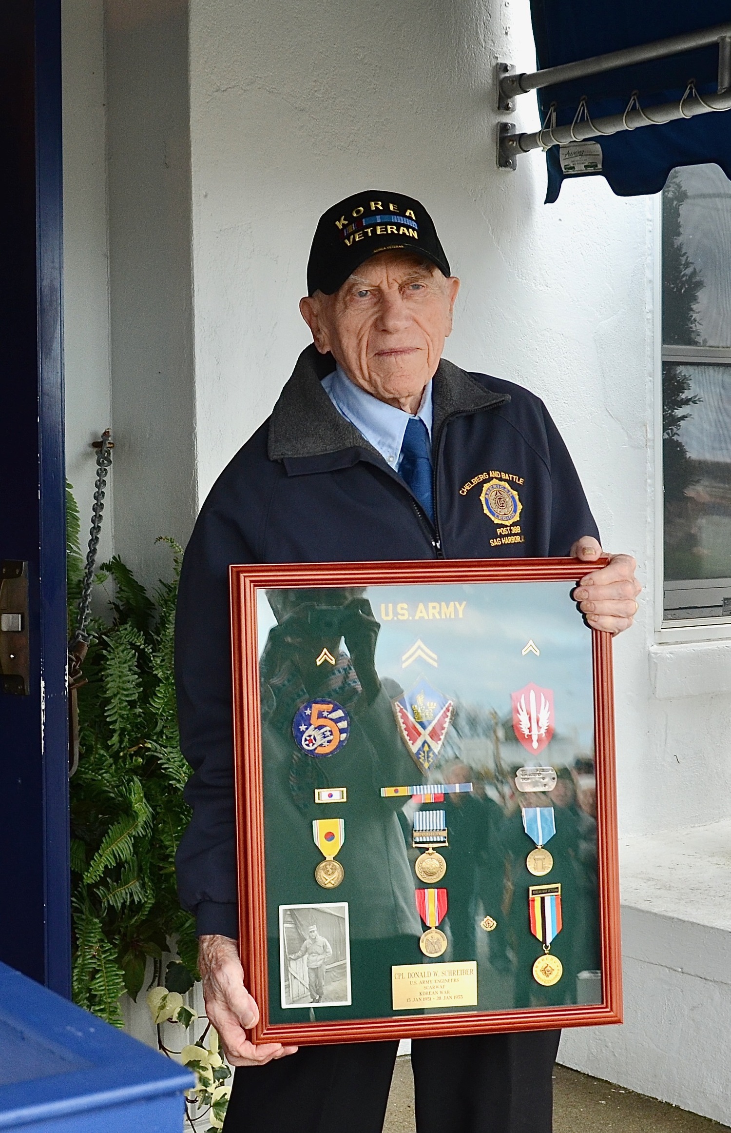 Korean War veteran Don Schreiber was surprised by his family with a shadow box containing patches and medals from his service in the U.S. Army. KYRIL BROMLEY PHOTOS