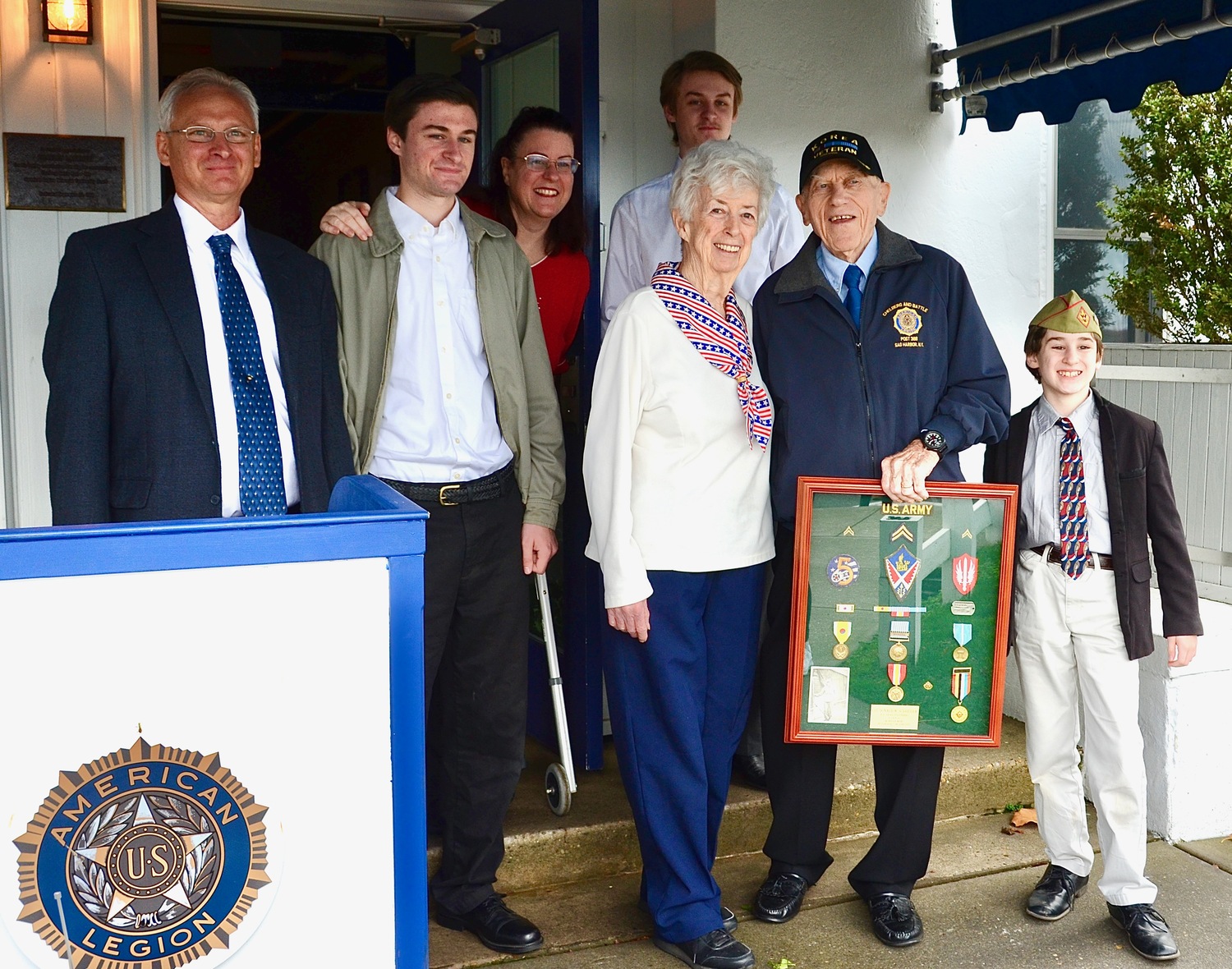 Korean War veteran Don Schrieber was surprised by his family with a shadow box containing patches, medals and other memorabilia from his military service. With Schrieber are, from left, his son-in-law Scott Comenzo, grandson Daniel Comenzo, daughter Noreen Comenzo, wife Nora Schrieber, grandson Patrick Comenzo, and grandson Nathan Comenzo. KYRIL BROMLEY PHOTOS