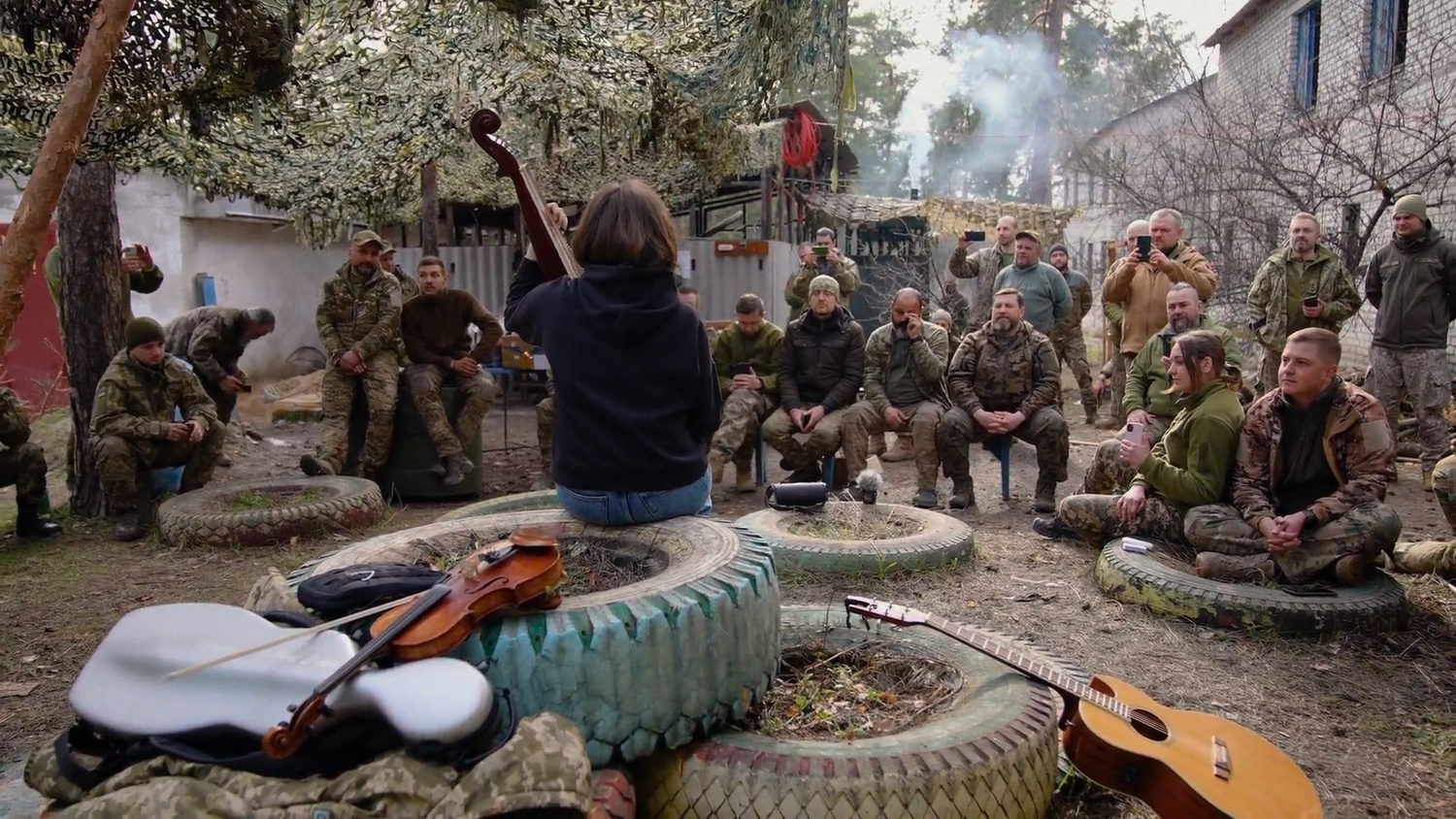 A bandura player performs for Ukrainian soldiers. ARTEM POZNANSKYI