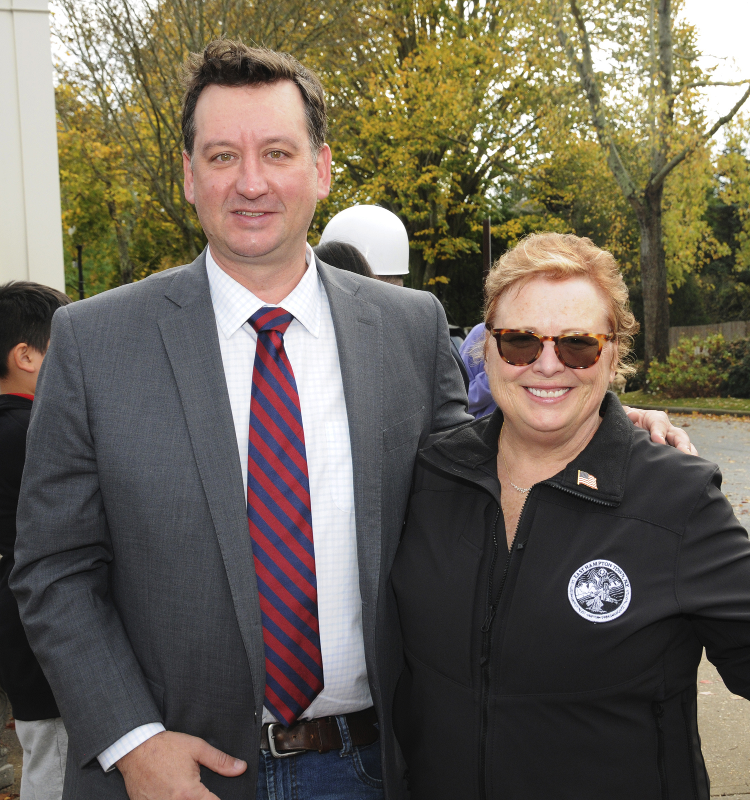 East Hampton Town Councilmember Ian Calder-Piedmonte and East Hampton Town Deputy Supervisor Cate Rogers at Veterans Day services in East Hampton on Monday.   RICHARD LEWIN