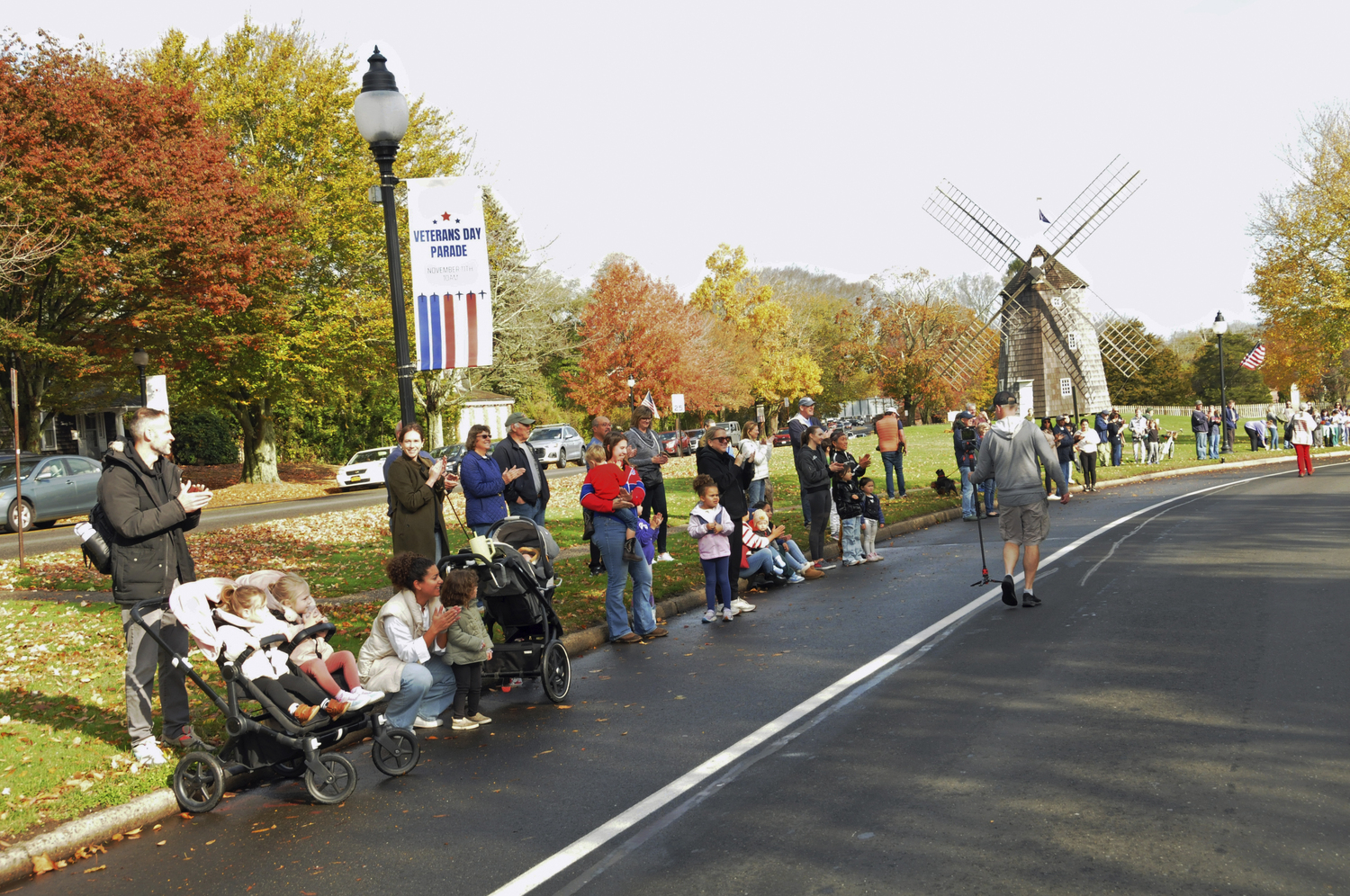 Supporters on the route during the Veteran's Day parade in East Hampton on Monday.   RICHARD LEWIN