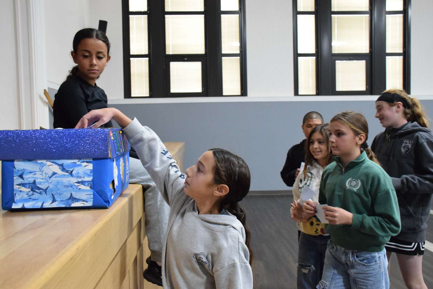 Eastport-South Manor Central School District elementary school students participated in a democratic process on Nov. 4 by casting their votes in mock elections. Eastport Elementary School mock election official Iyla Bruno makes sure ballots cast by peers are properly placed in the ballot box. COURTESY EASTPORT-SOUTH MANOR SCHOOL DISTRICT