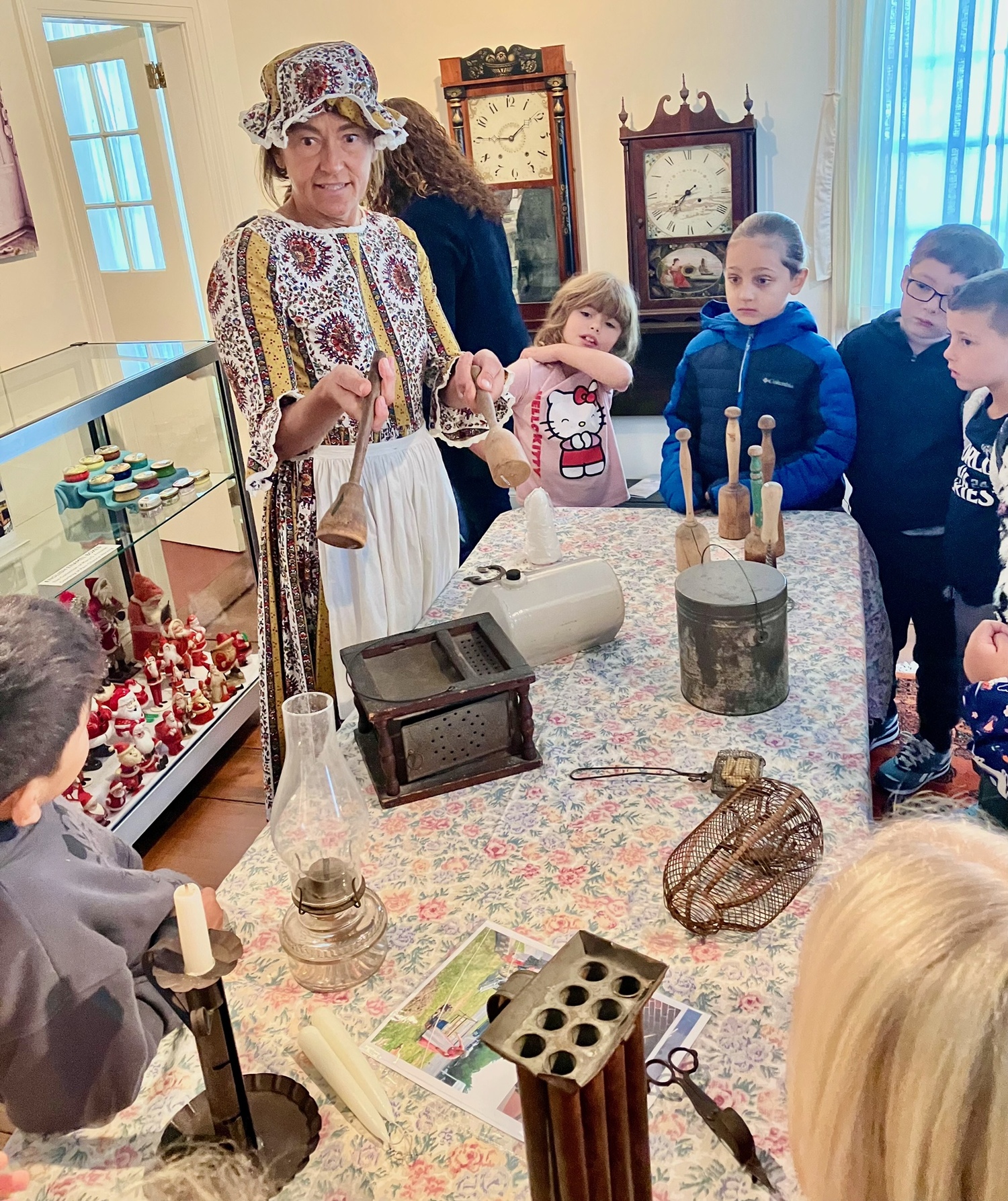 Dawn La Du talks to Westhampton Beach Elementary School second graders about the exhibits at the Greater Westhampton Historical Museum. COURTESY GREATER WESTHAMPTON HISTORICAL MUSEUM