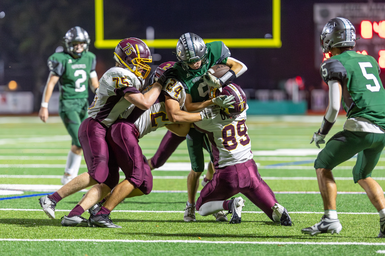 Westhampton Beach senior Drew Calloway is taken down by three Kings Park defenders.   RON ESPOSITO