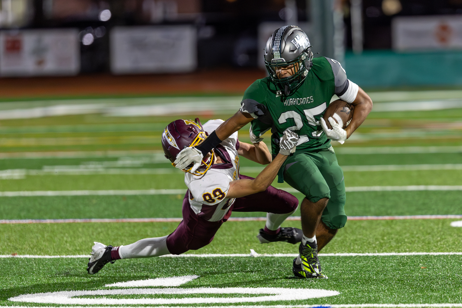 Westhampton Beach junior Nick Simone gives a good stiff arm to a Kings Park defender.   RON ESPOSITO