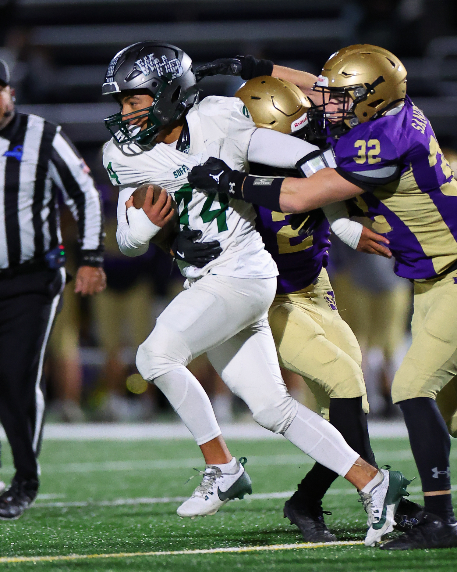 Westhampton Beach senior Aidan Arrasate breaks a tackle for a gain.    TIMOTHY BUTLER