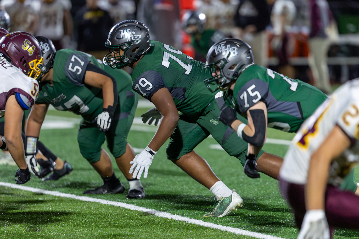 Defensive linemen Kristopher Muralles, left, sophomore Jeadyn Cobb and Kyle Strong.   RON ESPOSITO