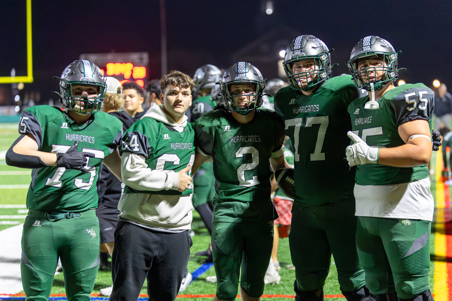 All was good for the 'Canes on Friday night as seniors Kyle Long, left, Carter Gordon and Finn Drake and juniors J.P. Peters and Benjamin Magee give the thumbs up.   RON ESPOSITO