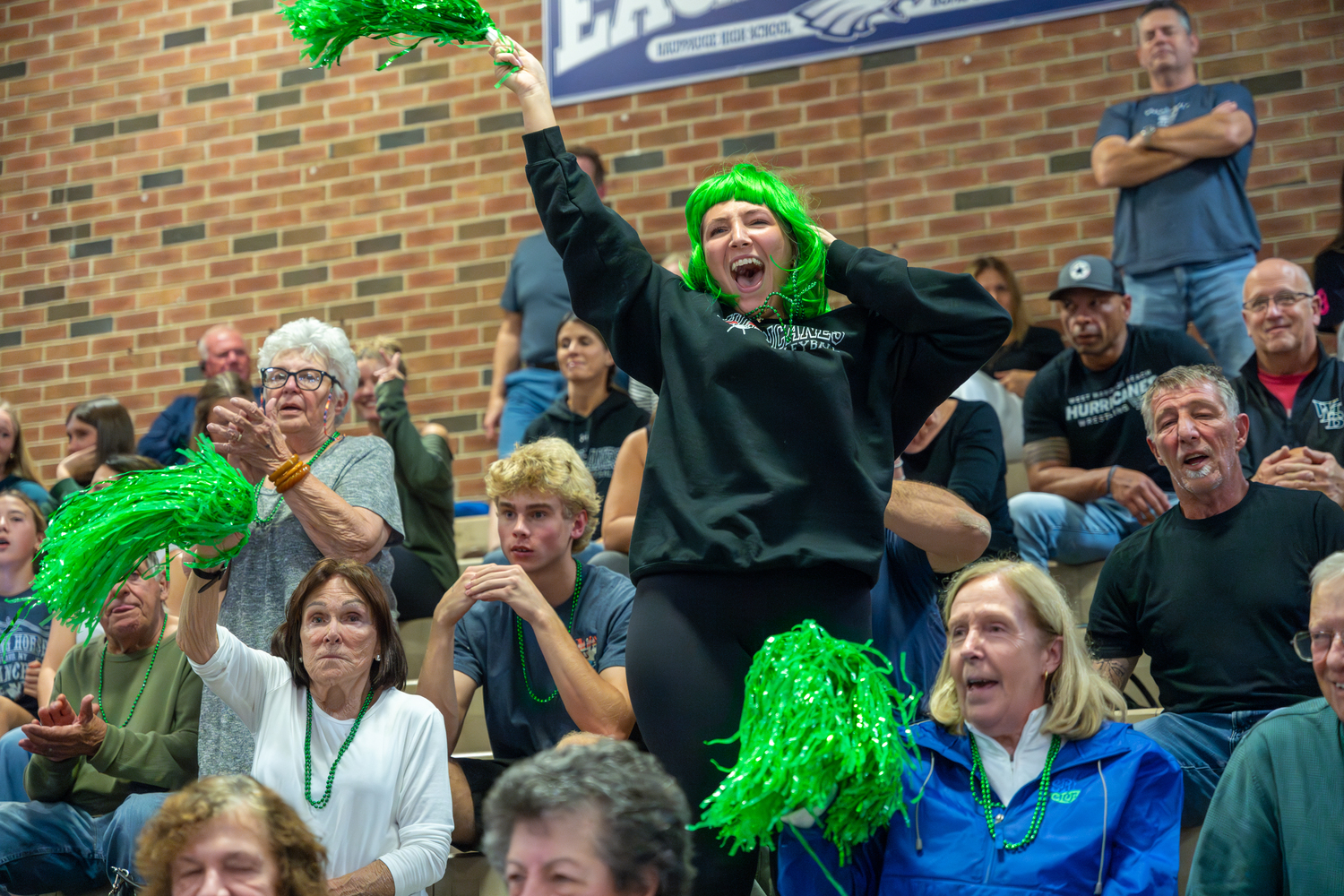 A Westhampton Beach fan get the crowd excited during the decisive fifth set. RON ESPOSITO