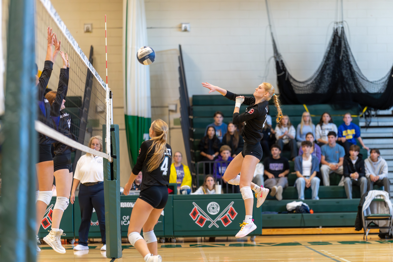 Westhampton Beach junior right side Mia Hill sends the ball back over the net. RON ESPOSITO