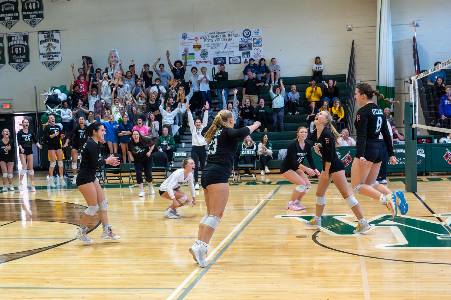 Westhampton Beach's girls volleyball team celebrates its five-set Suffolk County Class A semifinal win over Hampton Bays. RON ESPOSITO